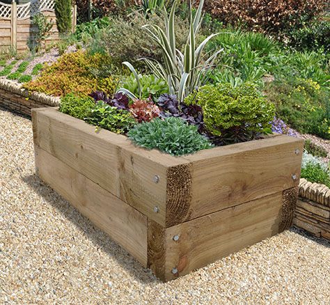 Oak sleeper raised planting bed with mature planting