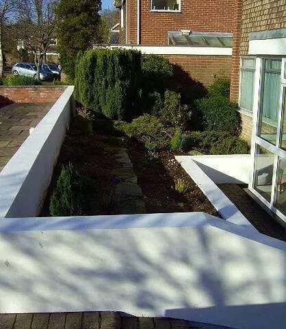After — Front garden wall rebuilt and rendered white